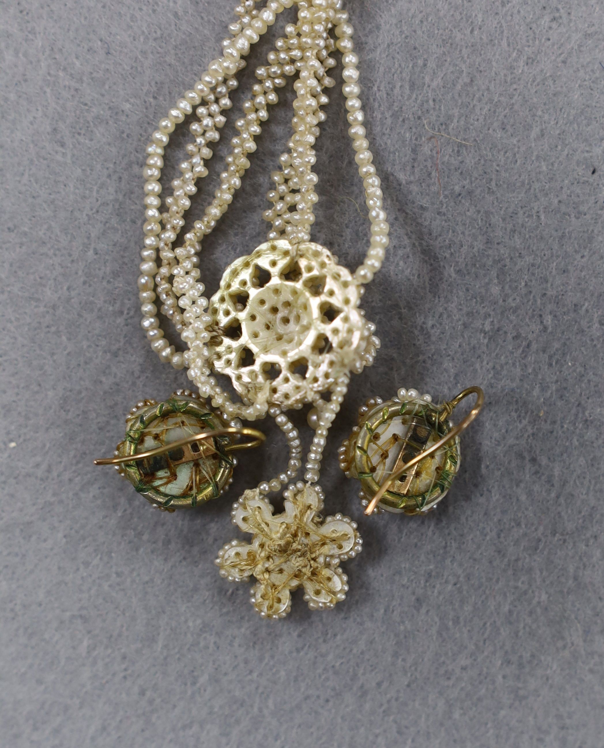 A 19th century multi strand seed pearl necklace, 40cm and a pair of similar earrings.